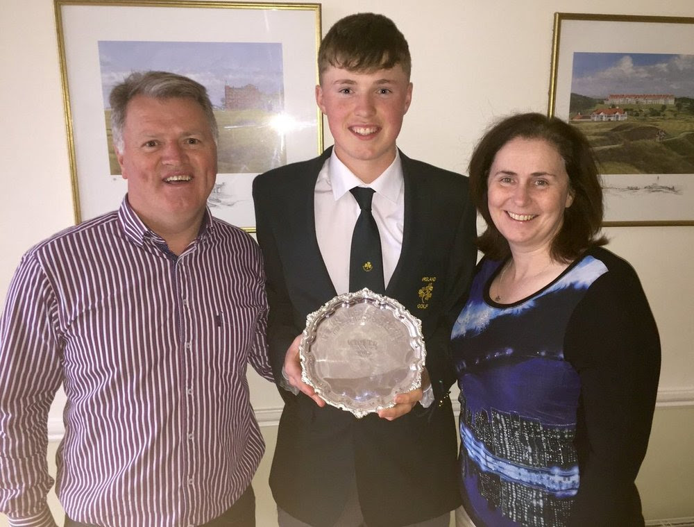 Mark Power shows off the Peter McEvoy Trophy with his parents Eddie and Eileen Rose, both three time former Irish Amateur Close champions. Picture, courtesy Eddie Power