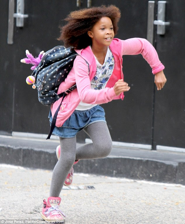 Cool running: Quvenzhané sprinted down the street with a spotty backback at one point during filming 
