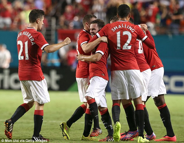 Quick-fire: Mata is mobbed by team-mates after completing the turnaround for United