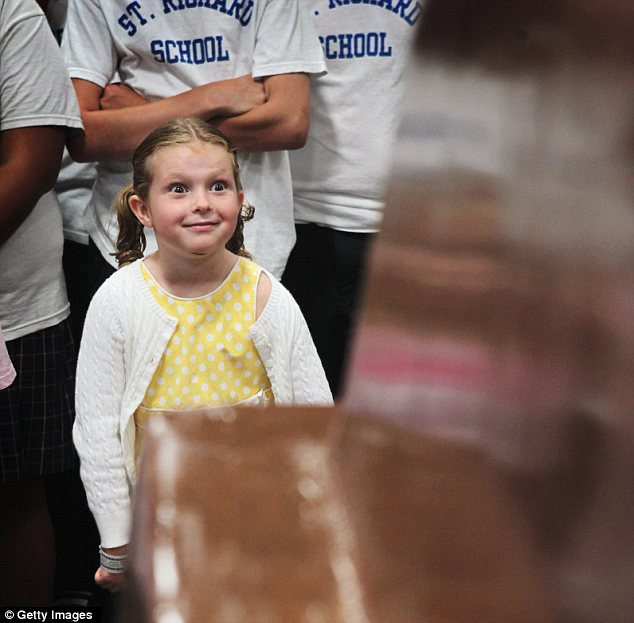 Salivating: Children can't wait to take a bite out of the world's largest chocolate bar