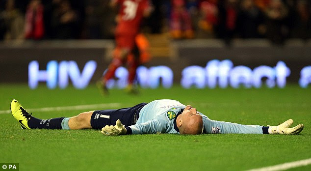 Not again: It was a tough night for Canaries 'keeper John Ruddy who must be sick of the sight of the striker