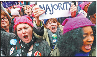 Protesters cheer at the women s march on washington during 