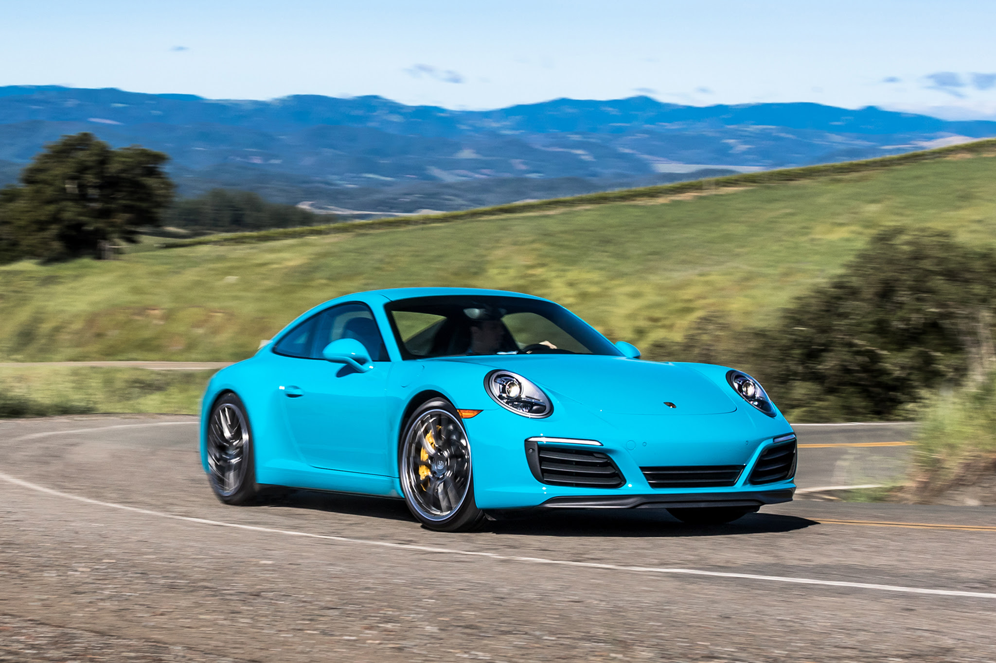 2017 Porsche 911 Carrera S front three quarter in motion 06