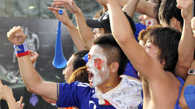 Thousands of youth celebrate Japan's victory against Denmark in the World Cup in downtown Tokyo on Friday.