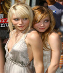 The Olsen Twins rubbing each other.