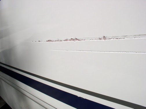 how this for a scratch in the hull? - boat talk