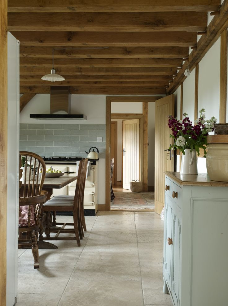Country kitchen... oak beams, cream aga and touches of grey blue