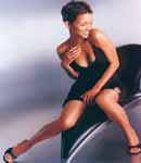 Halle Berry in a tight short black dress.