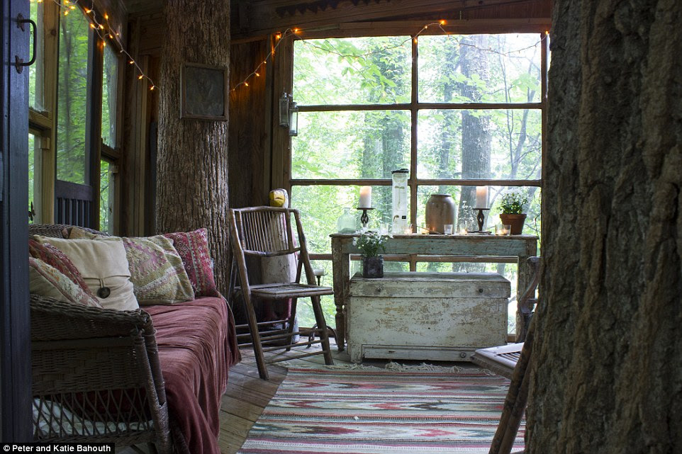 The rustic living room has been decked out with shabby chic furniture, while colourful accessories add warmth to the cosy scheme