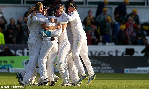 Winners: England celebrate the penultimate wicket of Nathan Lyon