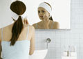 woman using cleanser