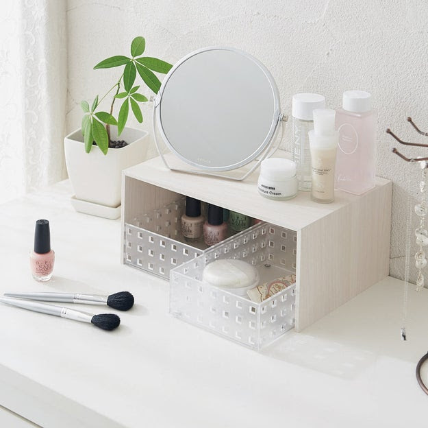 A rack riser with pocket shelves that'll finally give you the added counter space your roommate still thinks you don't need.