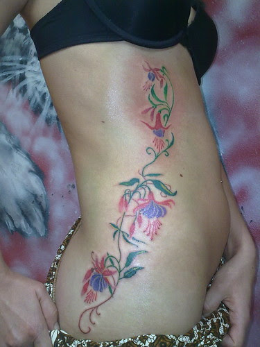 Flower Tattoo at Bursts Sides Woman 