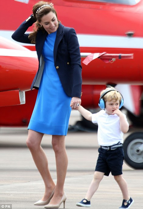 Prince George clutched his mother's hand throughout the event