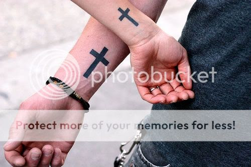 cross tattoo on wrist