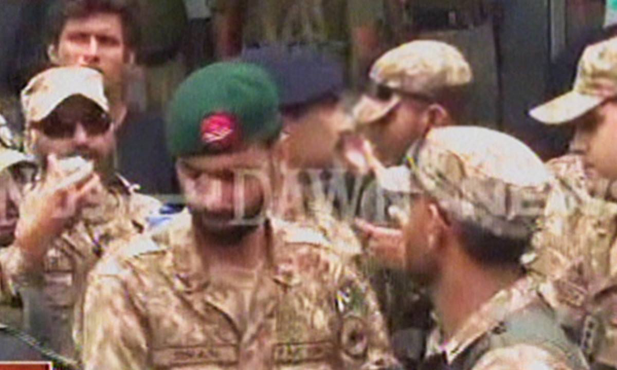 Army personnel who had the protesters leave PTV HQ. — videograb