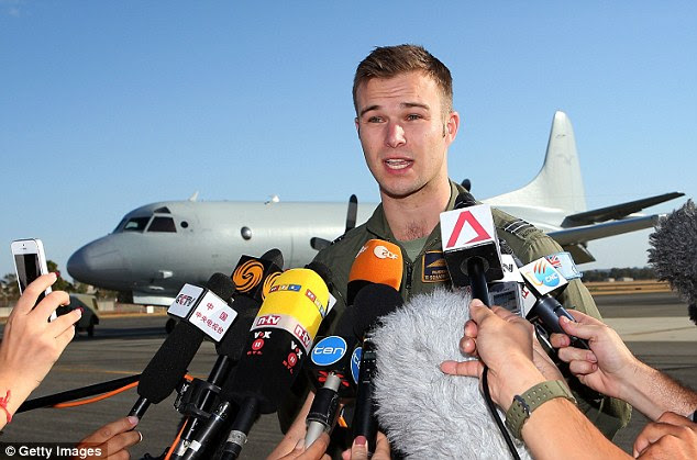 'We've got a lot of hope': Captain Russell Adams, the pilot of the Australian P3 Orion updates the media on the search for MH370 in the southern Indian Ocean after landing back at Pearce air base in Perth