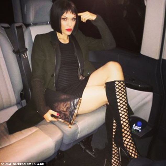 Travelling in style: Jessie strikes a pose in the back of a taxi