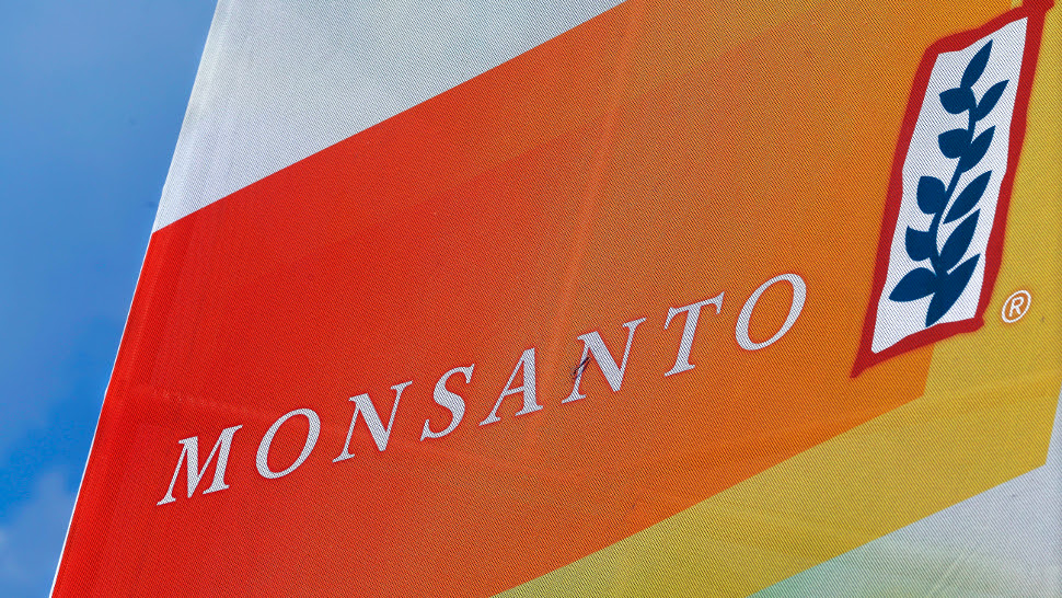 FILE - This Aug. 31, 2015 file photo shows the Monsanto logo seen at the Farm Progress Show in Decatur, Ill. German drug and chemicals company Bayer AG says it has made a $62 billion offer to buy U.S.-based crops and seeds specialist Monsanto Company. Bayer said Monday, May 23, 2016 that the all-cash offer values Monsanto shares at $122 each. (AP Photo/Seth Perlman, File)