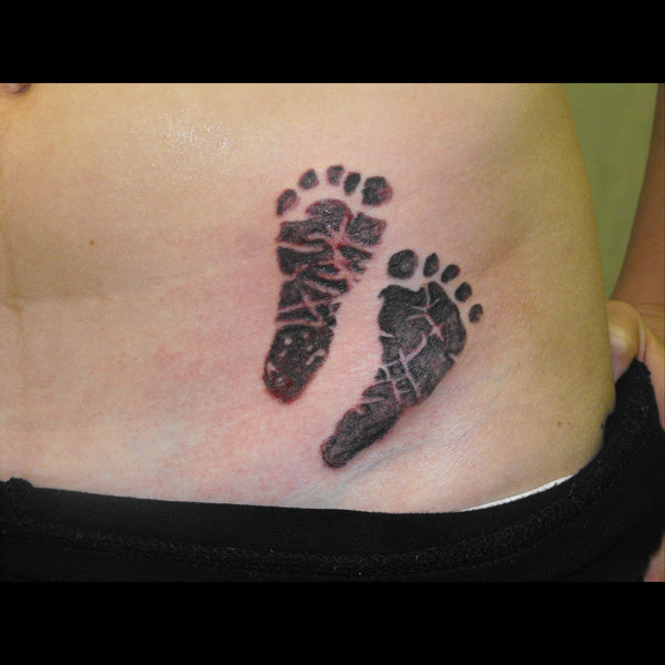 baby footprints tattoo. aby footprint tattoo