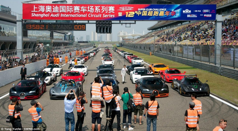 Photocall: Ultra-wealthy petrolheads from across the supposed communist state showed up at the track with their dream machines. On the front row of the grid alone were five cars worth a combined £18million 