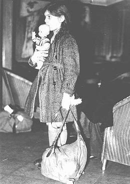 Refugee girl, part of a Children's Transport (Kindertransport), shortly after arrival in Harwich. Great Britain, December 2, 1938.  — Bibliotheque Historique de la Ville de Paris