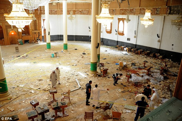 Carnage: Medics and security forces gather inside the Imam Sadiq Mosque attempt to secure the scene following the devastating blast