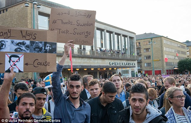 Clashes: Tensions are rising in Sweden as it struggles to cope with a record influx of migrants and asylum seekers (pictured: An estimated 15,000 people attended a Refugees Welcome rally in Gothenburg last year)