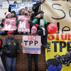 Protesters of varied stripes and political affiliations gathered outside the Office of the U.S. Trade Representative where negotiators from 12 nations were meeting to discuss the Trans-Pacific Partnership.