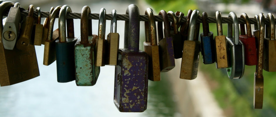 Multiple locks hanging on a cable.