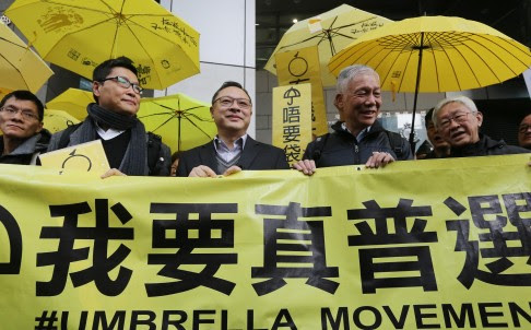 Occupy founders appear at police HQ yesterday. Photo: Sam Tsang