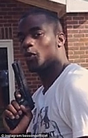 Foolish: Sebastien Bassong posed with this gun