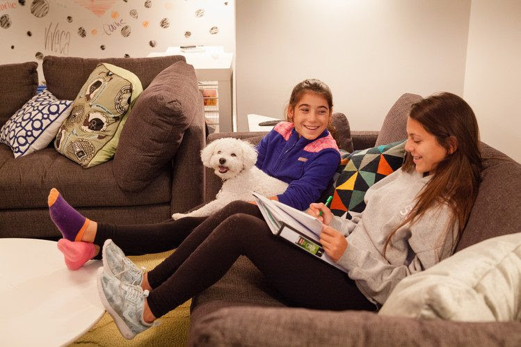 Cousins Ava Khan and Viveca Khan with pup, Dante