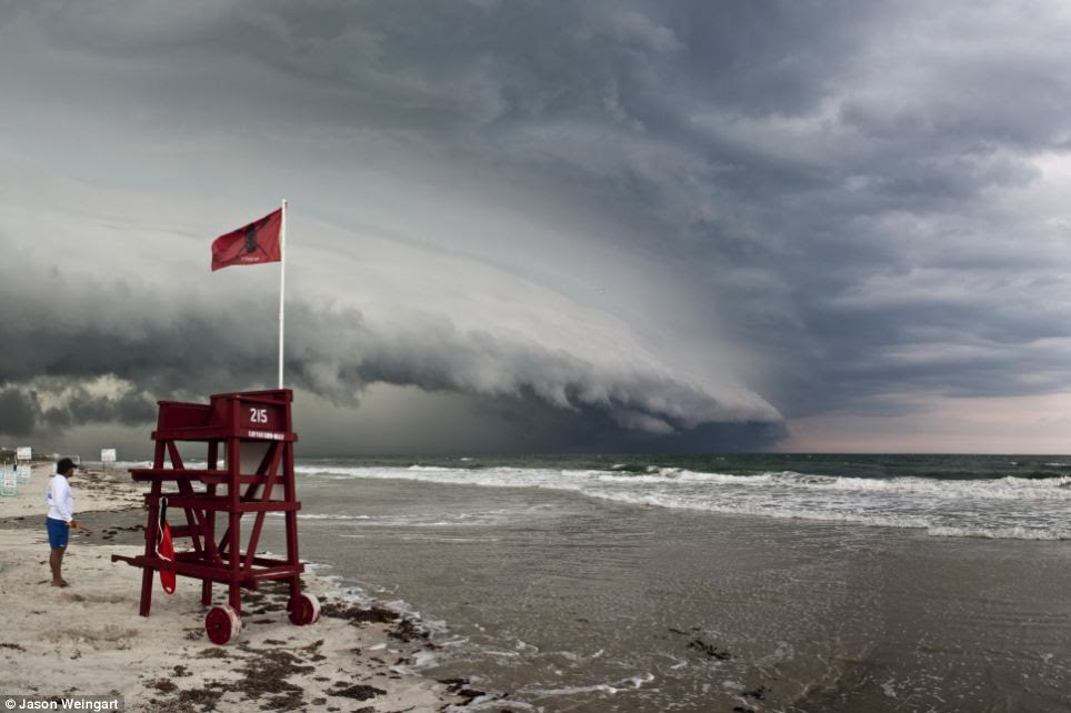 Rolling in: Lifeguards at Ormond beach in Florida started taking precautions about the weather