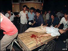 A girl wounded in clashes between students and soldiers near Tiananmen Square (4 June 1989) Manuel Ceneta/AFP