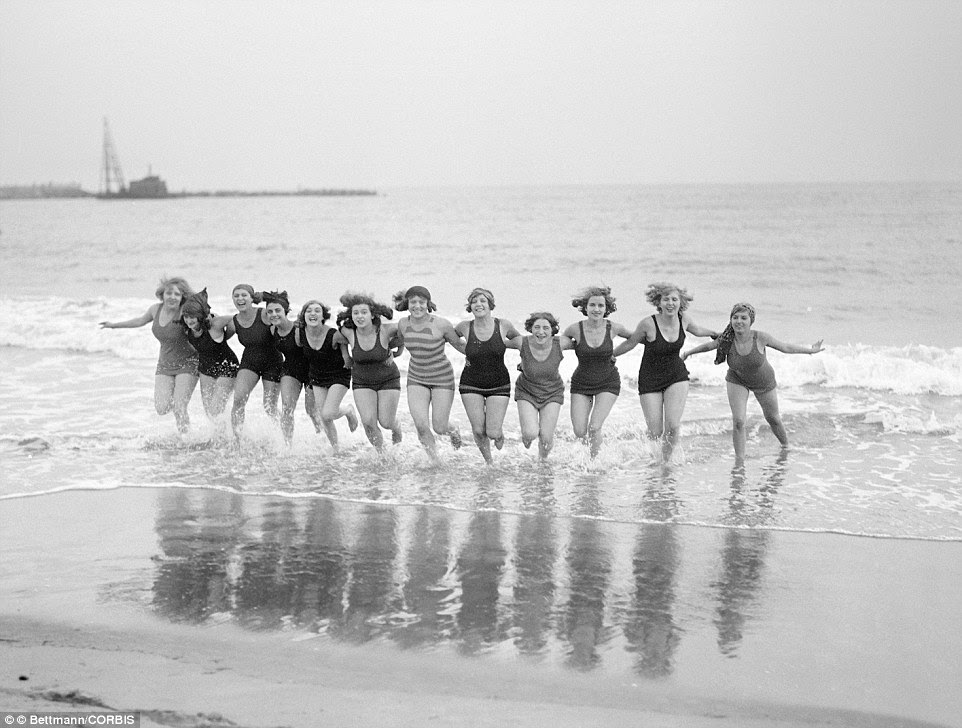This group of girlfriends running out of the cold October sea in 1925 are sporting the now-sleeveless bathing suits popular with the time
