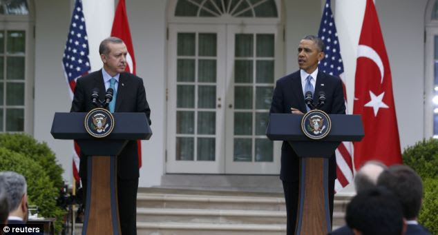 Barack Obama (R) and Turkish Prime Minister Recep Erdogan hold a joint news conference in the White House Rose Garden, but most of the focus was on three unfolding White House scandals