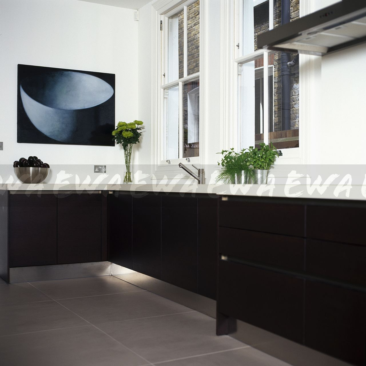 Image: Stainless steel kickboards in modern white kitchen ...