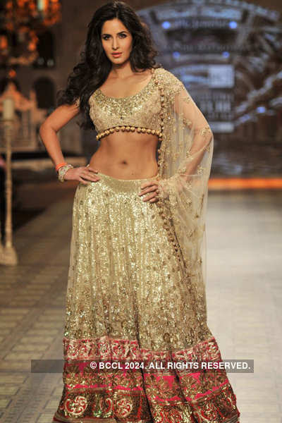 Bollywood actress Katrina Kaif showcases a creation by designer Manish Malhotra during the Day 4 of PCJ Delhi Couture Week 2012 at hotel Taj Palace, New Delhi on August 11, 2012