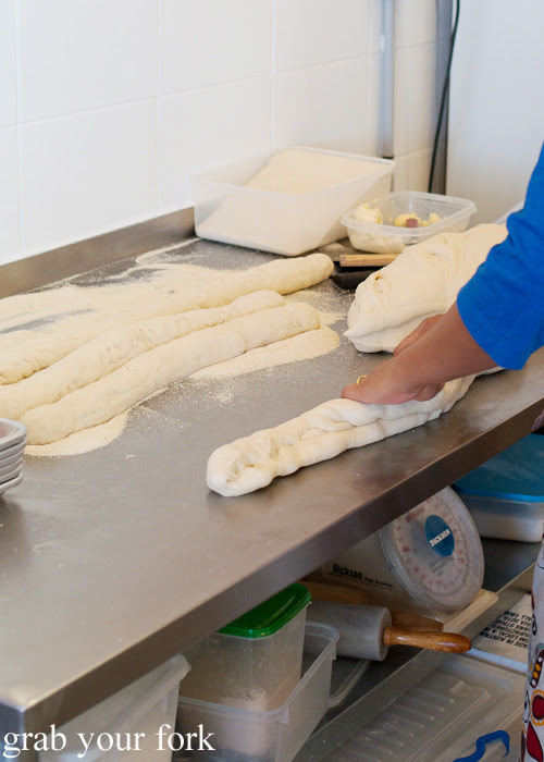 Rolling out dough for pandesal at Pandesal Bakehouse, Beverly Hills