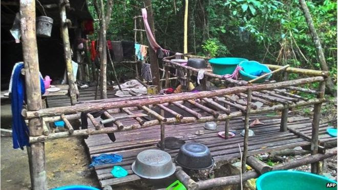 This undated handout photo made available on 25 May 2015 by the Royal Malaysian Police shows an abandoned migrant detention camp used by people-smugglers in a jungle near the Malaysia-Thailand border in Genting Perah.