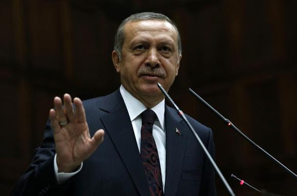 Turkey's Prime Minister Tayyip Erdogan addresses members of parliament from his ruling AK Party (AKP) during a meeting at the Turkish parliament in Ankara April 8, 2014. REUTERS/Umit Bektas