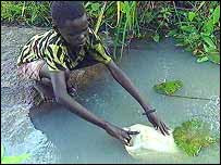 Sudanese child fetching water from Yei River