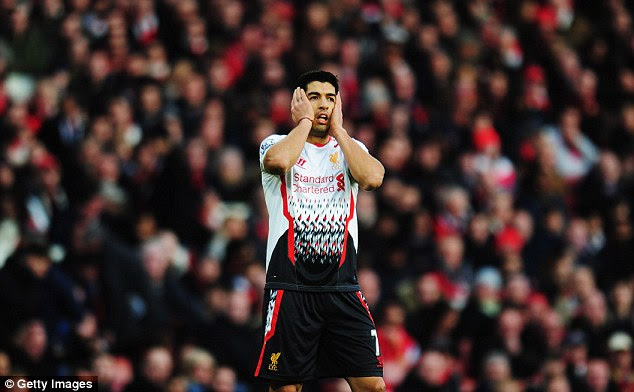 Distraught: Luis Suarez can;t believe that Howard Webb didn't award Liverpool a second penalty