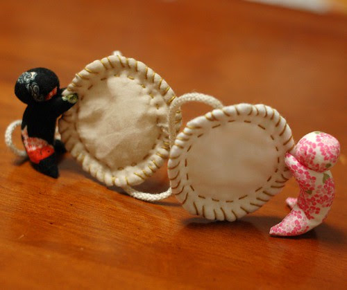 Sarubobo holding coin mobile