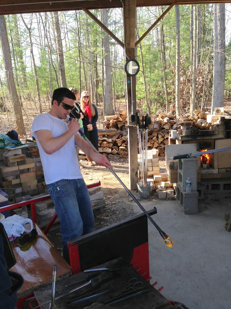 Elliot Henry blowing glass.
