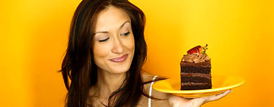 Photo by Corbis (Woman Eyeing a Slice of Chocolate Cake)
