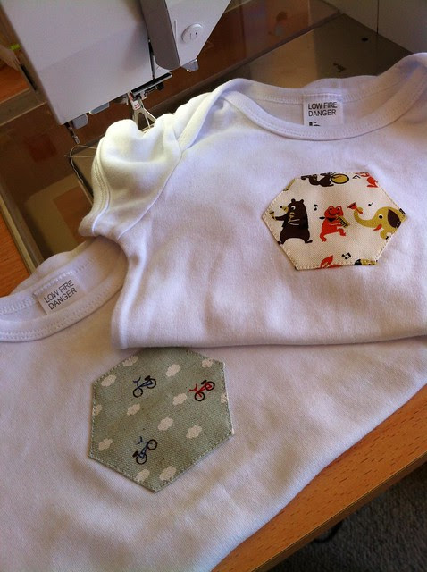Hexagon appliques for the baby of a fello hexagon addict