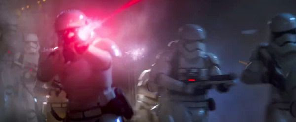 First Order Stormtroopers open fire on Jakku villagers (off-screen) in STAR WARS: THE FORCE AWAKENS.