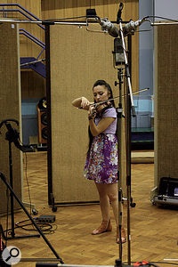 When you're deciding how to mic an instrument, it can help to have the performer play in several different places in the room. Once they locate a place that sounds good to them, use the 'listen and wander' approach to find the best mic position.